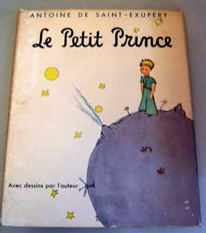 A photograph of the cover of the children’s book The Little Prince in French. The French title reads Le Petit Prince.