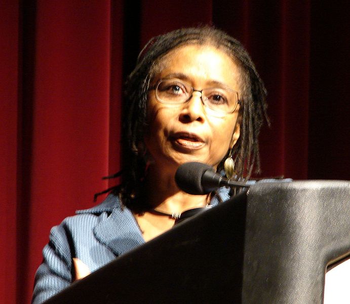 Photo of author Alice Walker standing behind a podium