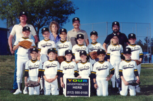 A baseball team poses for a picture. They’re holding a sign that reads ‘Your Advertisement Here.’
