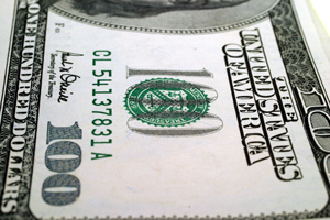 A photograph of a portion of a one hundred dollar bill