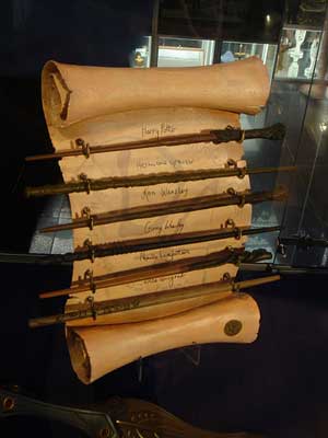 A scroll and magic wands, with Names written on the scroll 