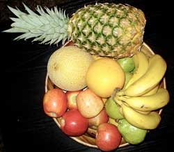 a bowl of whole pieces of fruit 