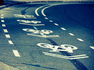 A photograph of a bike lane on a curve in a road.