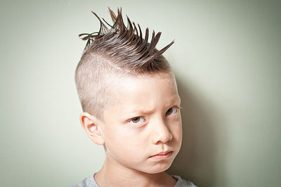 headshot of a boy with classic Mohawk hairdo