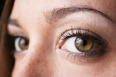 An up close photograph of a woman’s eyes.