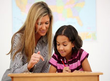  Image of a female teacher helping a student