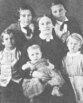 Image of Mary Adams Maverick holding an infant and surrounded by her children