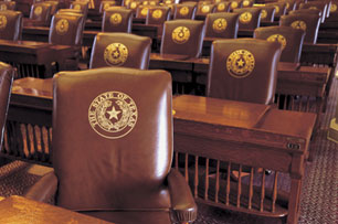 Image of rows leather seats embossed with the State of Texas seal