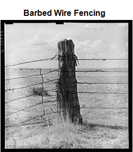 Image of a Corner post of a fence made of barbed wire