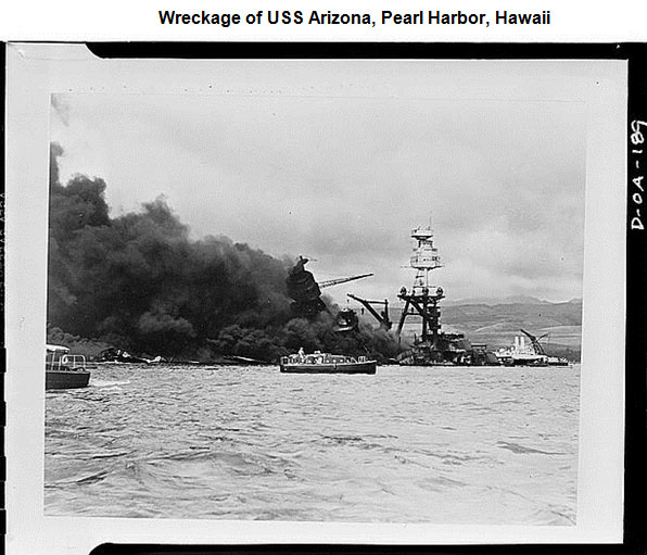 Image of the USS Arizona with plumes of smoke billowing from the ship