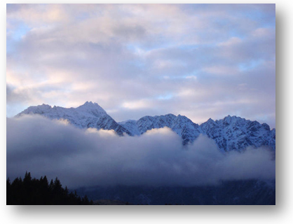 a line of clouds covering The Remarkables Mountain Range in New Zealand