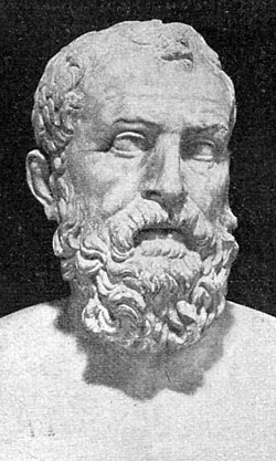 A marble bust of Solon of Athens, a man in late middle age with short hair and a full beard.