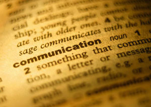 Close up picture of the word communication in a dictionary