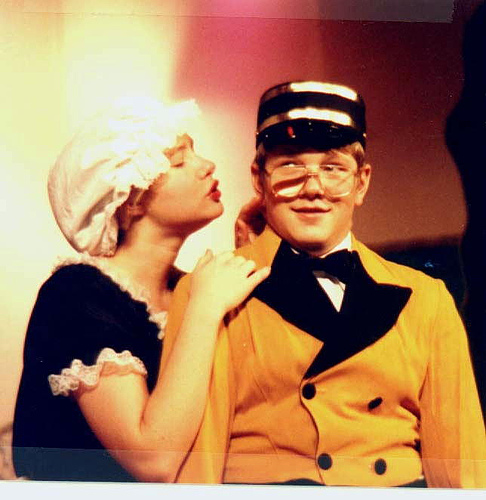 A photograph of two actors performing a scene from Thornton Wilder’s “Skin of Our Teeth”