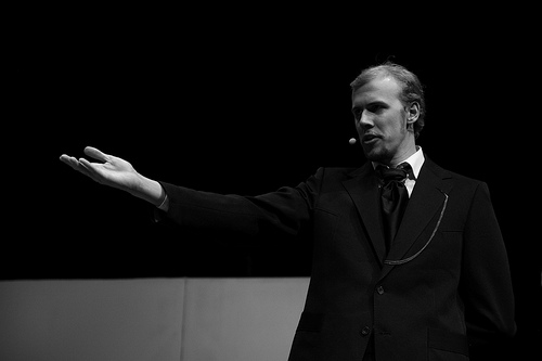 A photograph of an actor giving a monologues during a production of Oscar Wilde’s “The Importance of Being Ernest”