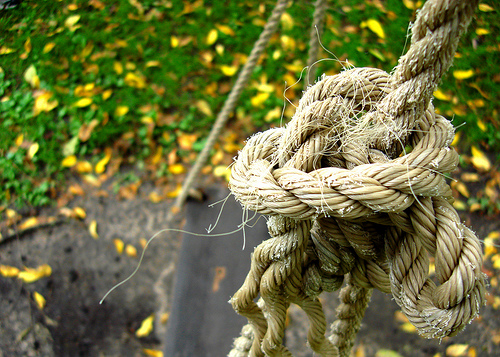 A photograph of a large knot tied in a rope