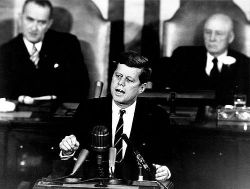 A photograph of President John F. Kennedy addressing congress