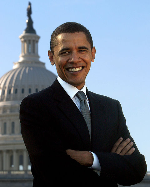 A portrait photograph of then Senator Barak Obama in front of the U.S. Capitol dome