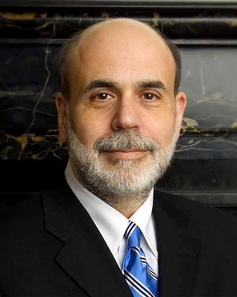 A photograph portrait of US Secretary of the Treasury Ben Bernanke. He is a middle-aged man with a full beard wearing a suit and tie.