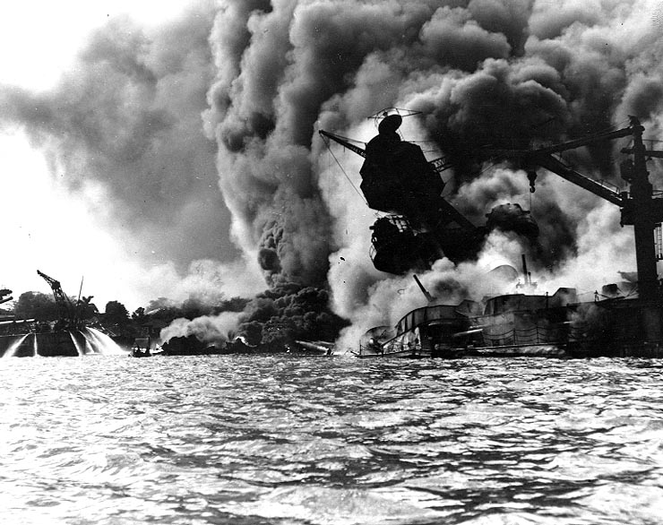 A photograph of the USS Arizona burning and sinking after being bombed during the attack on Pearl Harbor, Hawaii