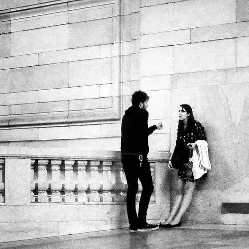 A photograph of a man and a woman having an argument