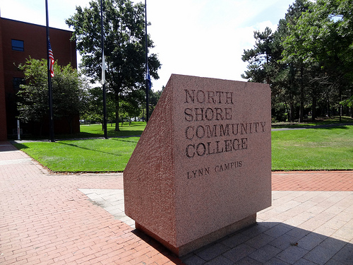 image of the entrance to a community college with its name carved in stone