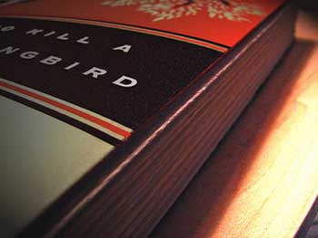 photograph of the book “To Kill a Mockingbird”. Only part of the book is visible. 