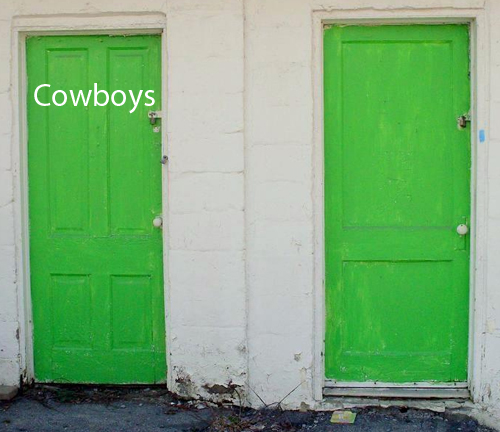 A photograph of two green bathroom doors at an abandoned convenience store.  The doors have padlocks on them.  One door has the word 'Cowboys' on it.