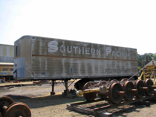photo of an old Southern Pacific semitrailer sitting in a train yard