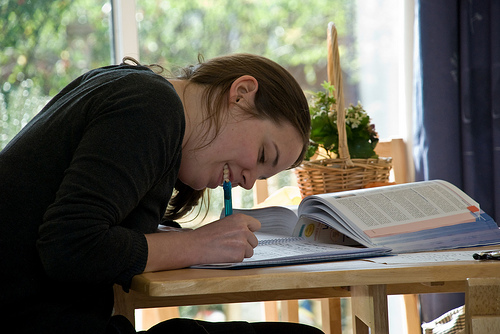 A photograph of a student’s writing in a notebook with it open in front of her