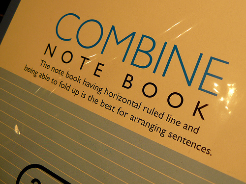 A photograph of a notebook titled “Combine: The notebook having horizontal ruled line and being able to fold up is the best for arranging sentences.