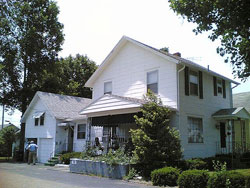 A photograph of an older house in the daytime