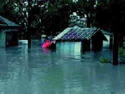 A photograph of a house that has been flooded