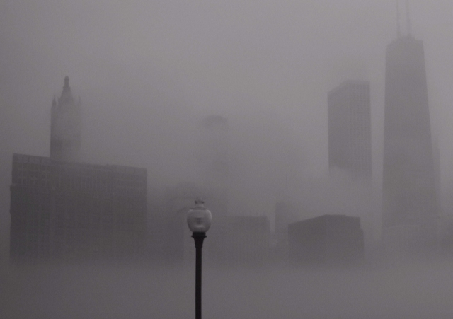 A photograph of the Chicago skyline enveloped in fog