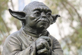A photograph of a statue of Yoda, a character from the George Lucas <em />Star Wars</em> series