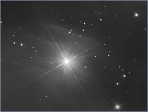 A photograph of a star, Merope, taken through a telescope.