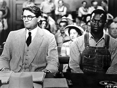 A movie still from the film “To Killing a Mockingbird.” Pictured are Atticus Finch and Tom Robinson in a courtroom.