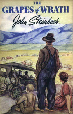Three family members look out over the plain and a line of cars headed across it on the cover of <em />Grapes of Wrath</em> by John Steinbeck