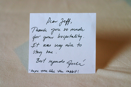 A photograph of a handwritten “Thank You” card. The writing is cursive text.