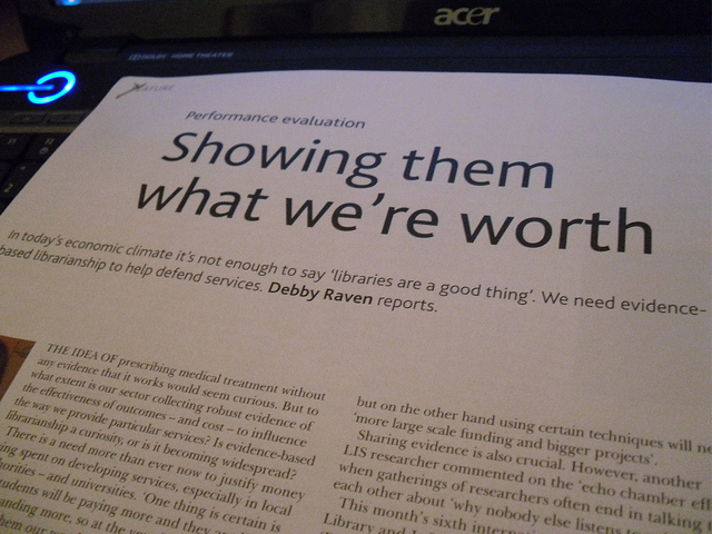 A photograph of a paper titled “Showing Them What We’re Worth.”