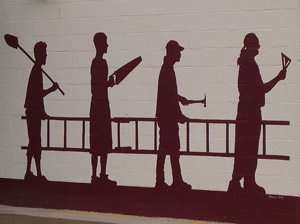A mural showing the outlines of four people carrying a ladder and working together on a project.