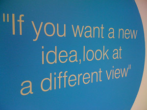 A mural with a text bubble that says “if you want a new idea, look at a different view.”
