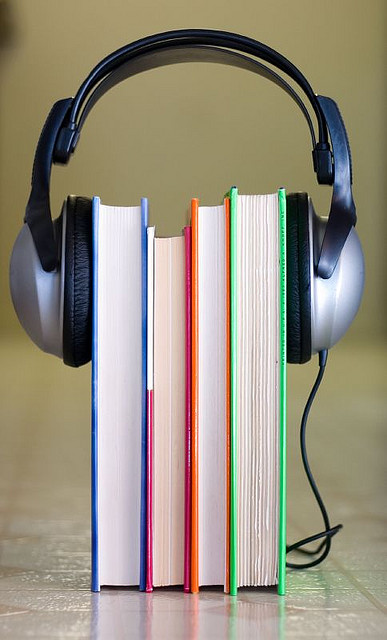 A photograph of a pair of headphones on books