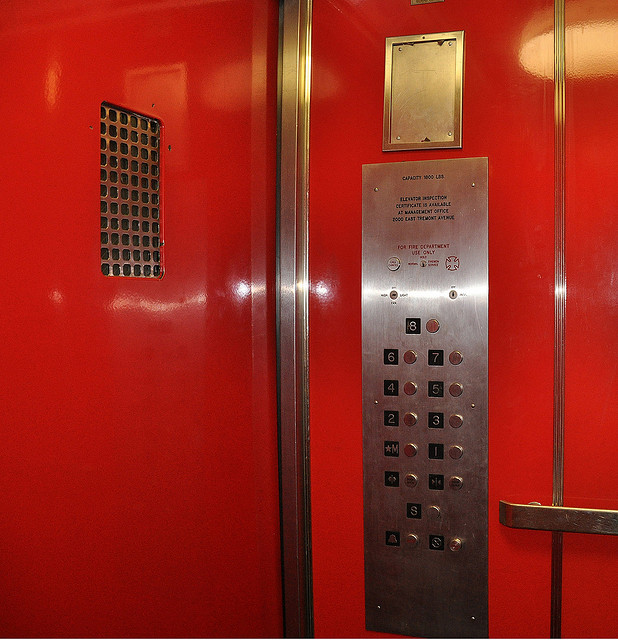 A photograph of the inside of an elevator car and the buttons, floors 8 through basement.