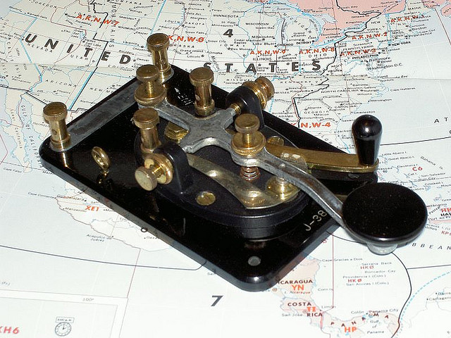 A telegraph transmitter on top of a map