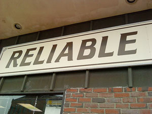 A sign outside of a store that reads: “Reliable”