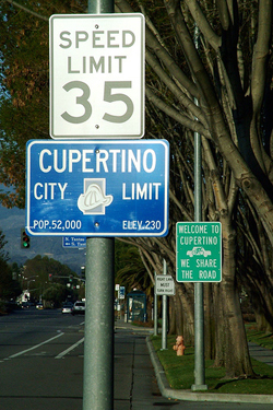 Photo of “Cupertino city limit” sign with speed limit sign above it—“35”