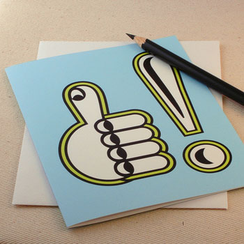 A photograph of a graphic rendering of a hand giving a thumbs up and an exclamation point