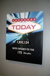 A poster that reads 'Las Vegas Valley Today: Pop. 1,932,124, water consumed per year 175 billion gallons'