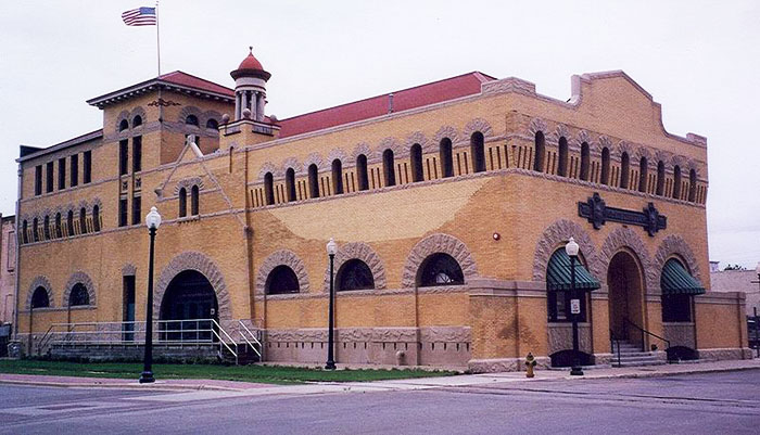 The Dr. Pepper Museum in Waco, Texas illustrates a stout building with a roof, walls, bricks, and mortar.